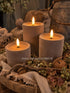 Drie taupe velvet stompkaarsen met LED-vlammen, flameless kaarsen van De Hooyzolder